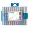 The pens arranged on a desk next to a colorful journal.
