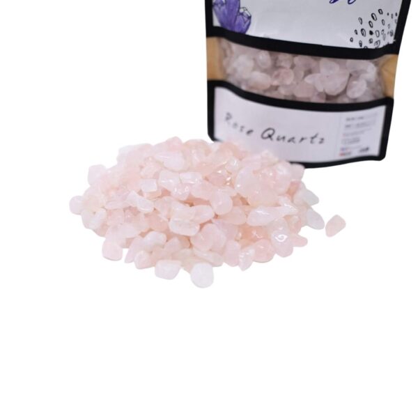 A close-up of a resin geode art piece with Rose Quartz crystals.